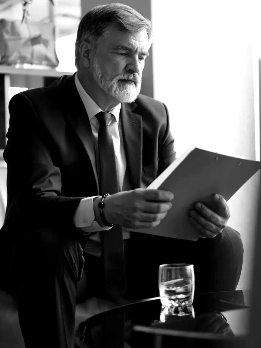A senior lawyer reviewing papers